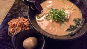 Chicken Ramen with an egg and fried garlic and onions on the side