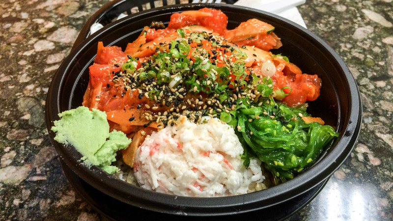 Medium poke bowl with three scoops of tuna and brown rice